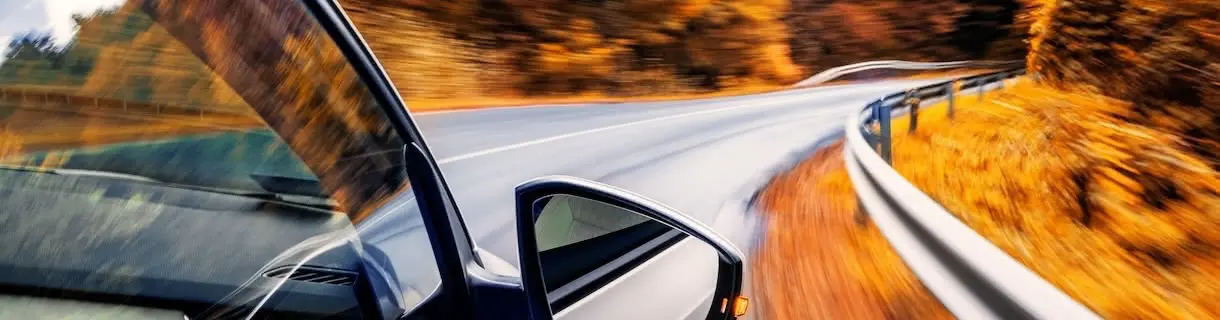 Car driving in the fall